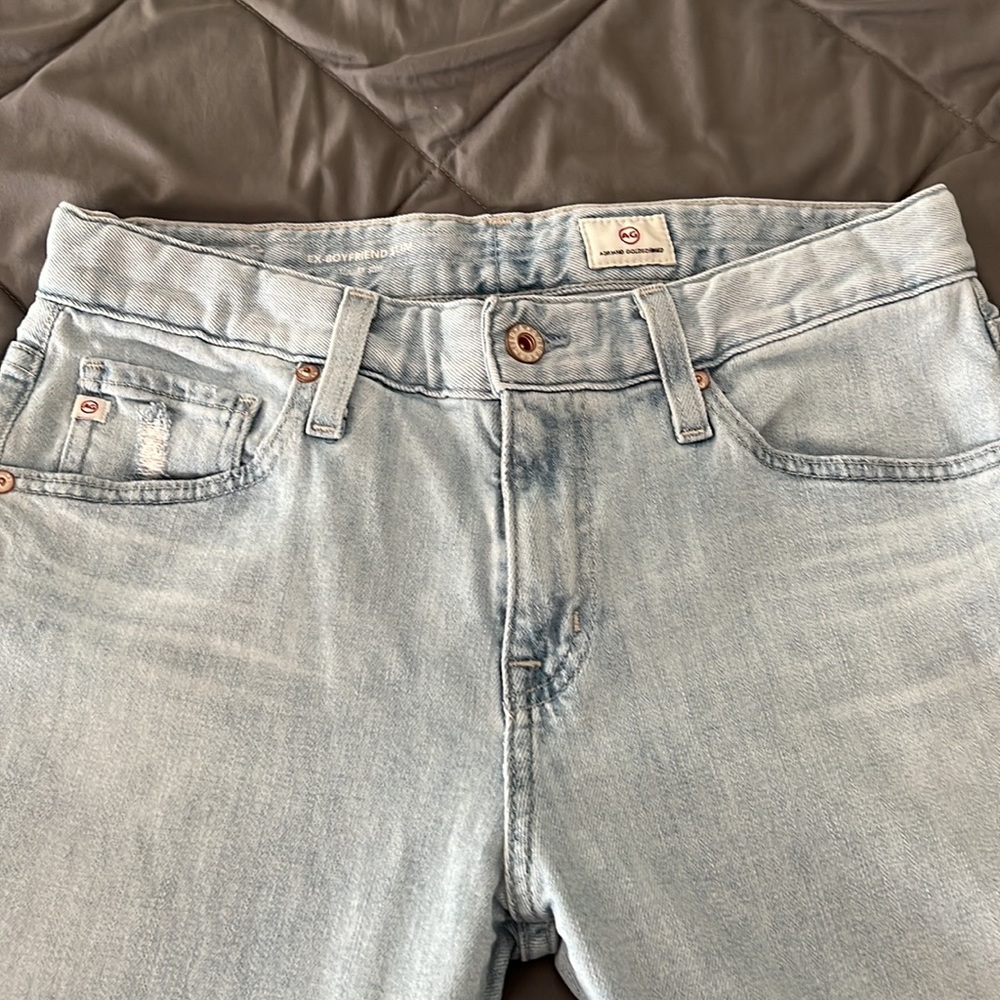 AG faded, distressed ‘Ex boyfriend slim’ in cloudy / faded blue.